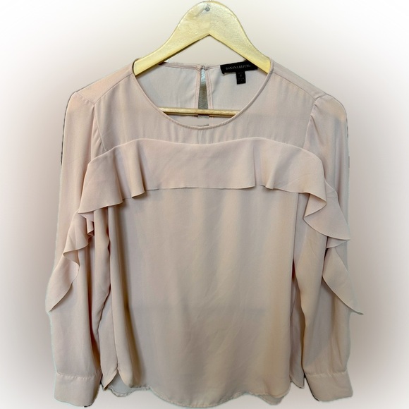 Blush pink blouse with ruffles down the sleeve. - Picture 1 of 3